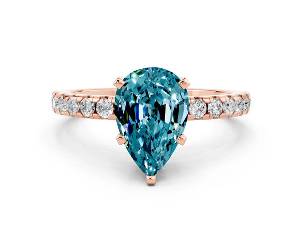 Rose gold Pear Cut Blue Topaz Solitaire Ring with Round Pavé Band and Four-Prong Setting