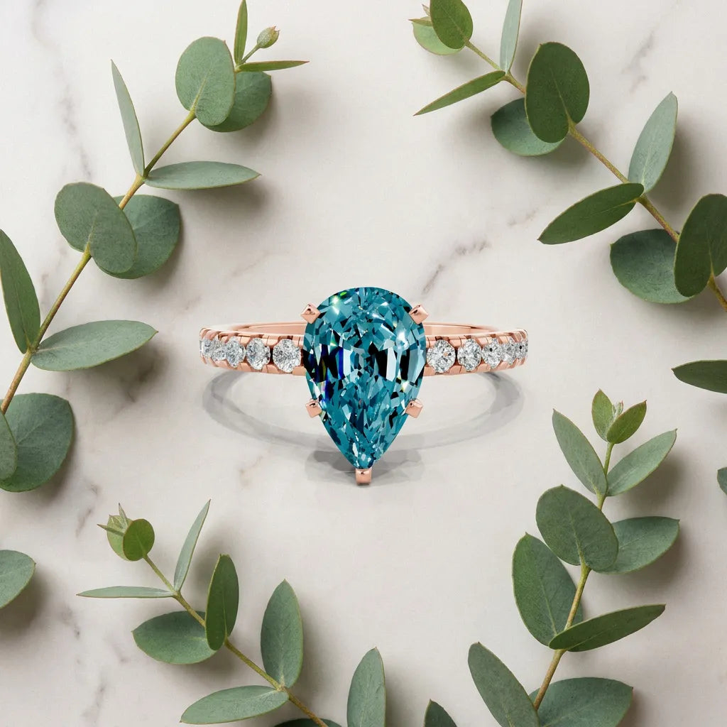 Rose gold Pear Cut Blue Topaz Solitaire Ring with Round  Pavé Band and Four-Prong Setting_45