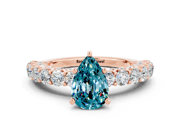 Rose gold Pear Cut Blue Topaz Solitaire Ring with Shared Prong Pavé Band and Four-Prong Setting
