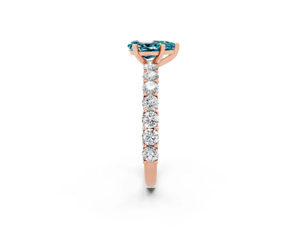 Rose gold Pear Cut Blue Topaz Solitaire Ring with Shared Prong Pavé Band and Four-Prong Setting