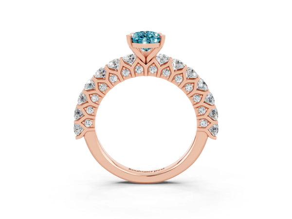 Rose gold Pear Cut Blue Topaz Solitaire Ring with Shared Prong Pavé Band and Four-Prong Setting
