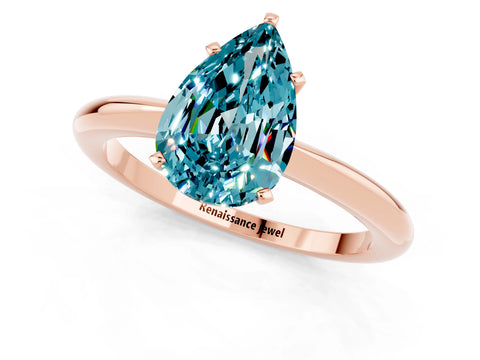 Rose gold Pear Cut Blue Topaz Solitaire Ring with Six-Prong Setting and Classic Band_1