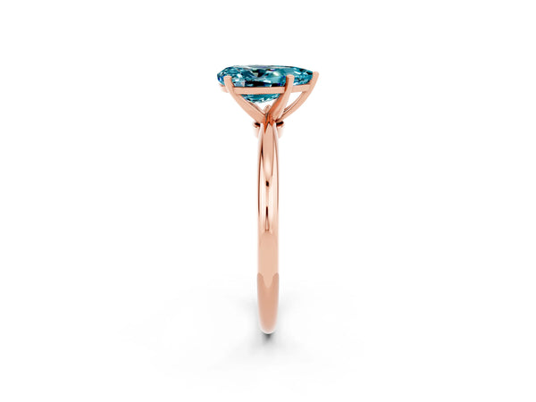 Rose gold Pear Cut Blue Topaz Solitaire Ring with Six-Prong Setting and Classic Band
