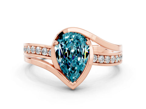 Rose gold Pear Cut Blue Topaz Solitaire Ring with Split Shank and Prong Setting