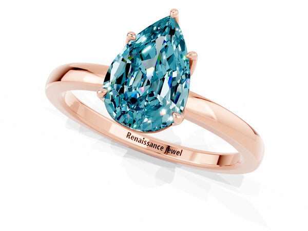 Rose gold Pear Cut Blue Topaz Solitaire Ring with Thin Band and Prong Setting