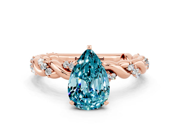 Rose gold Pear Cut Blue Topaz Solitaire Ring with Twisted Band and Pavé Accents