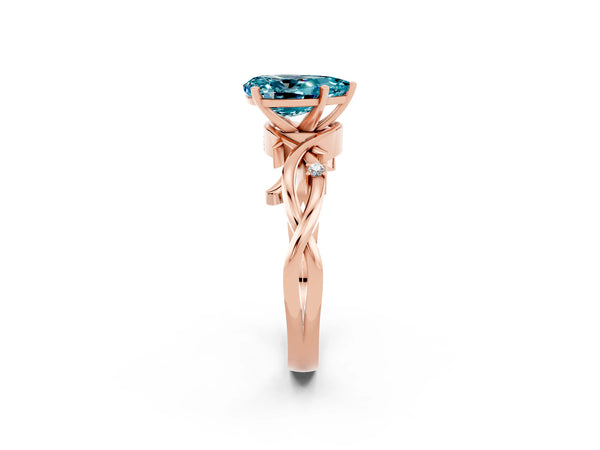 Rose gold Pear Cut Blue Topaz Solitaire Ring with Twisted Band and Prong Setting