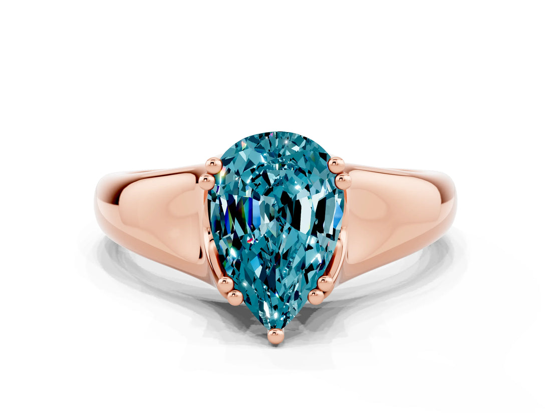Rose gold Pear Cut Blue Topaz Solitaire Ring with Wide Band and Prong Setting