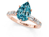 Rose gold Pear Cut Blue Topaz Solitaire with Side Baguettes and Channel Set Band_1