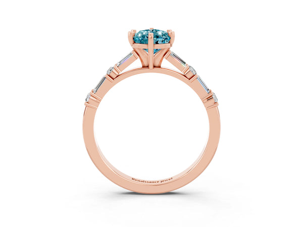 Rose gold Pear Cut Blue Topaz Solitaire with Side Baguettes and Channel Set Band