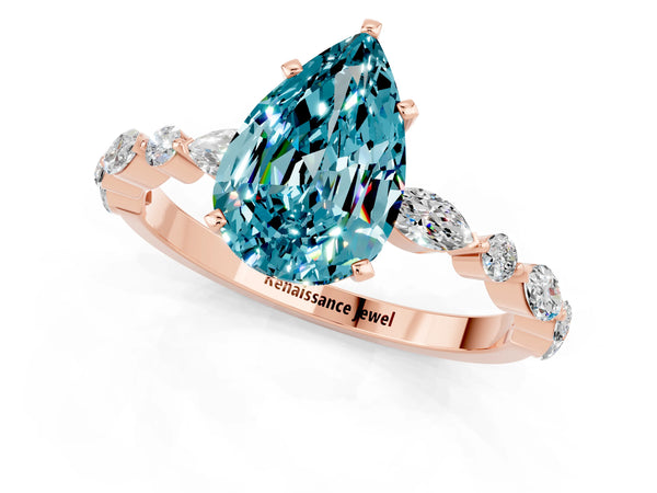 Rose gold Pear Cut Blue Topaz Ring with Marquise and Round  Side Stones and Four-Prong Setting