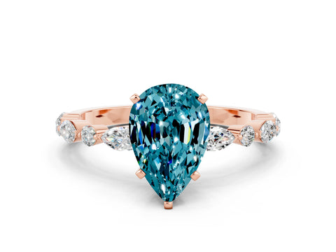Rose gold Pear Cut Blue Topaz Solitaire with Side Stones on a Pavé Band and Four-Prong Setting