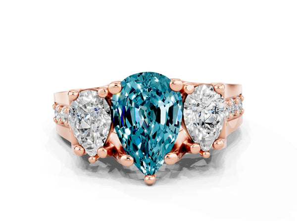 Rose gold Pear Cut Blue Topaz Three-Stone Ring with Channel Set Band and Four-Prong Setting