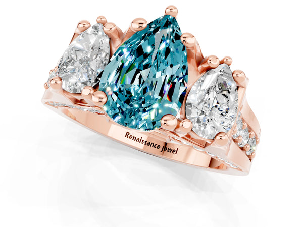 Rose gold Pear Cut Blue Topaz Three-Stone Ring with Channel Set Band and Four-Prong Setting