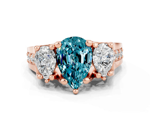 Rose gold Pear Cut Blue Topaz Three-Stone Ring with Channel Set Band and Four-Prong Setting