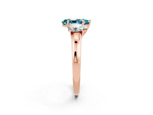Rose gold Pear Cut Blue Topaz Three-Stone Ring with Four-Prong Setting and Classic Band