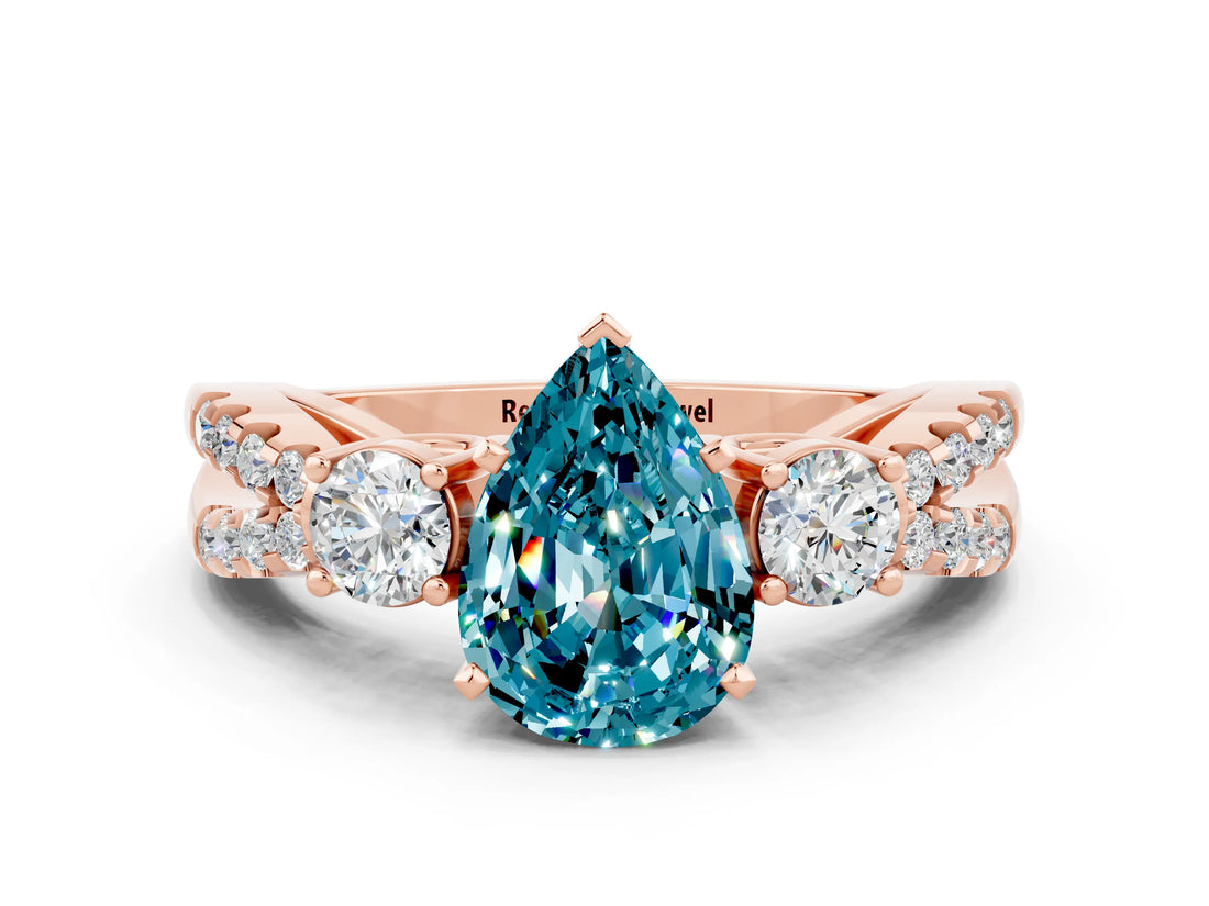 Rose gold Pear Cut Blue Topaz Three-Stone Ring with Pavé Split Shank and Four-Prong Setting_12