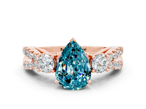 Rose gold Pear Cut Blue Topaz Three-Stone Ring with Pavé Split Shank and Four-Prong Setting