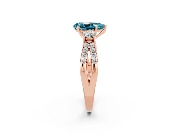 Rose gold Pear Cut Blue Topaz Three-Stone Ring with Pavé Split Shank and Four-Prong Setting