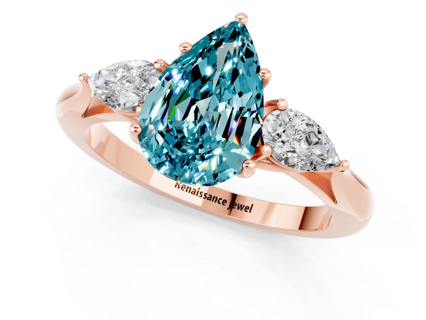 Rose gold Pear Cut Blue Topaz Three-Stone Ring with Pear  Side Stones and Prong Setting
