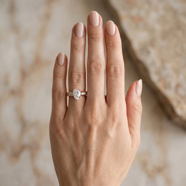 Rose gold Pear Cut Channel Set Solitaire Engagement Ring with Prong Setting