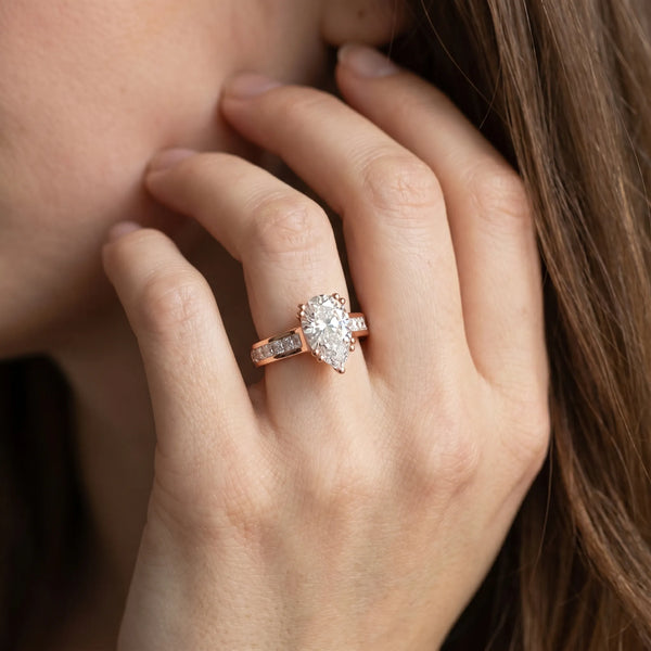 Rose gold Pear Cut Channel Set Solitaire Engagement Ring with Prong Setting