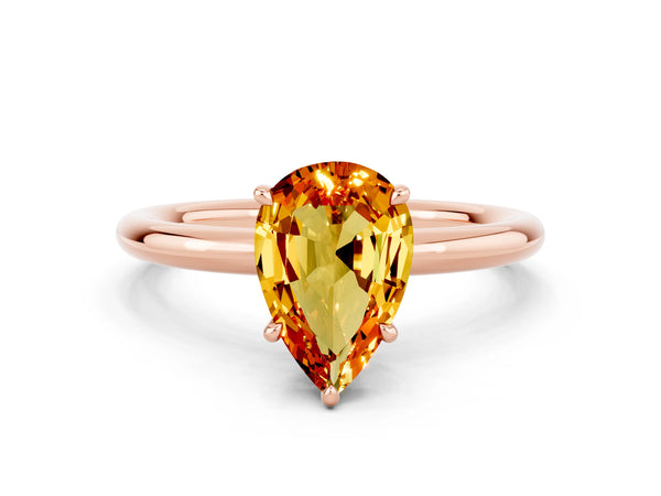 Rose gold Pear Cut Citrine Solitaire Ring with Thin Band and Four-Prong Setting