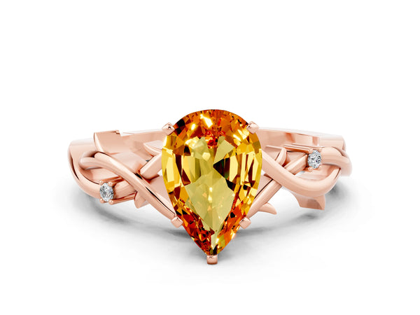 Rose gold Pear Cut Citrine Solitaire Ring with Twisted Band and Prong Setting
