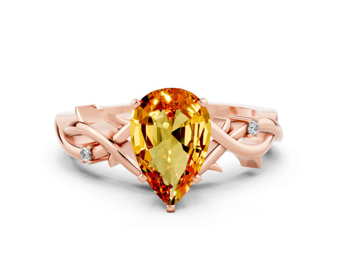 Rose gold Pear Cut Citrine Solitaire Ring with Twisted Band and Prong Setting