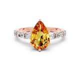 Rose gold Pear Cut Citrine Solitaire with Side Baguettes and Channel Set Band