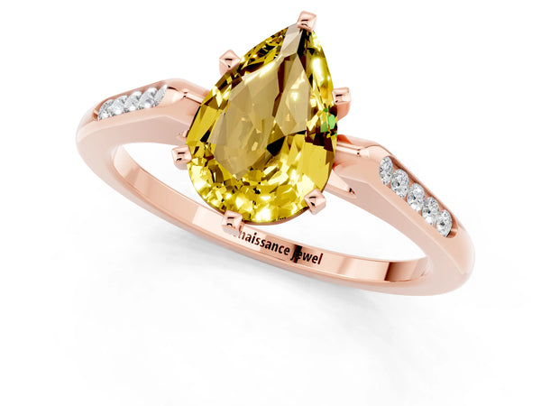 Rose gold Pear Cut Yellow Sapphire Solitaire Ring with Channel Set Round Band and Prong Setting