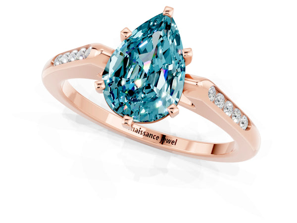 Rose gold Pear Cut Blue Topaz Solitaire Ring with Channel Set Round Band and Prong Setting
