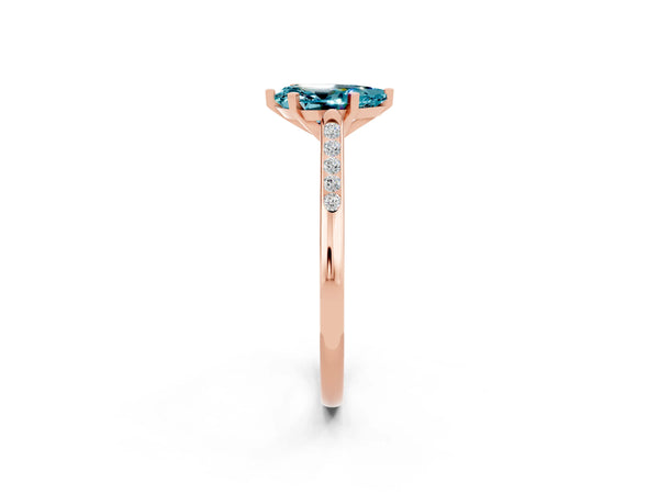 Rose gold Pear Cut Blue Topaz Solitaire Ring with Channel Set Round Band and Prong Setting