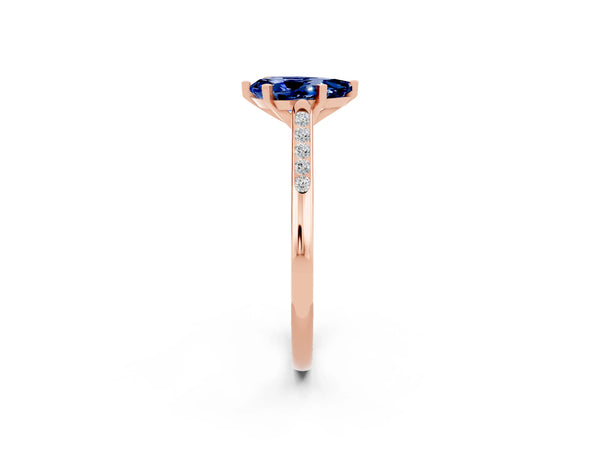 Rose gold Pear Cut Blue Sapphire Solitaire Ring with Channel Set Round Band and Prong Setting