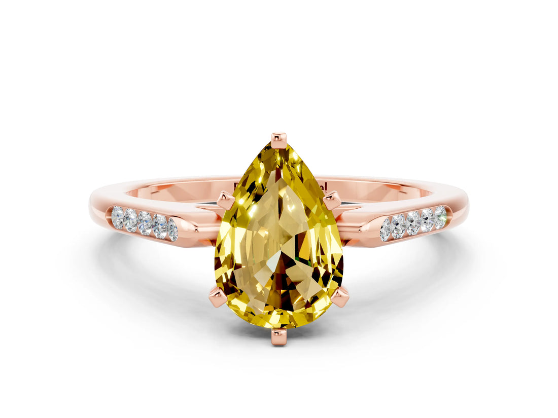 Rose gold Pear Cut Cut Channel Set Solitaire Engagement Ring with Four-Prong Setting