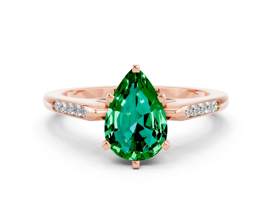 Rose gold Pear Cut Cut Channel Set Solitaire Engagement Ring with Four-Prong Setting