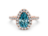 Rose gold Pear Cut Cut Diamond Floral Halo Engagement Ring with Pavé Band and Prong Setting