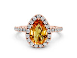 Rose gold Pear Cut Cut Diamond Floral Halo Engagement Ring with Pavé Band and Prong Setting