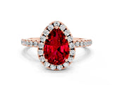 Rose gold Pear Cut Cut Diamond Floral Halo Engagement Ring with Pavé Band and Prong Setting