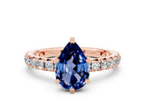 Rose gold Pear Cut Cut Diamond Pavé Band with Four-Prong Setting