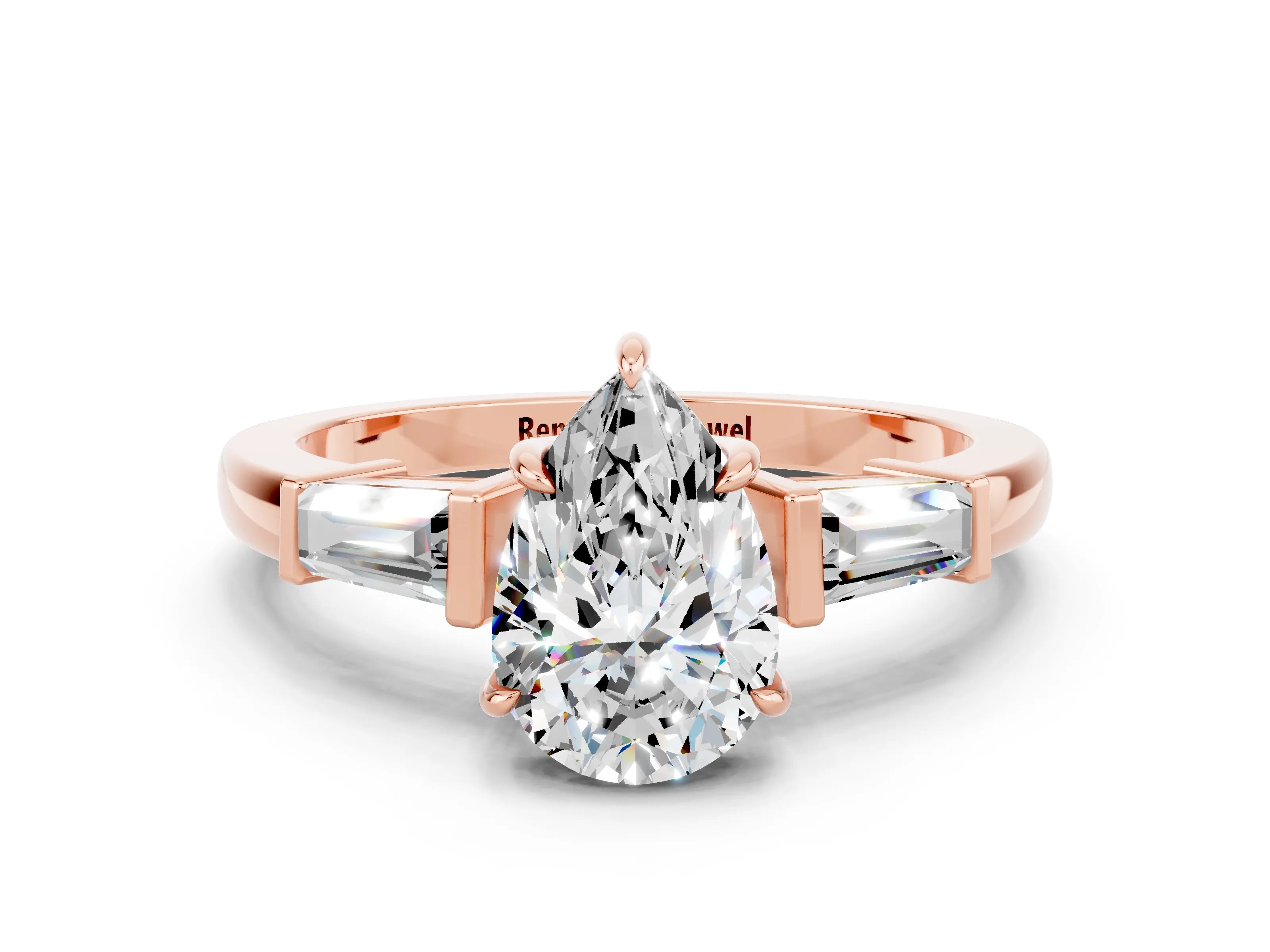 Rose gold Pear Cut Cut Diamond Ring with Tapered Baguette Side Stones in Four-Prong Setting