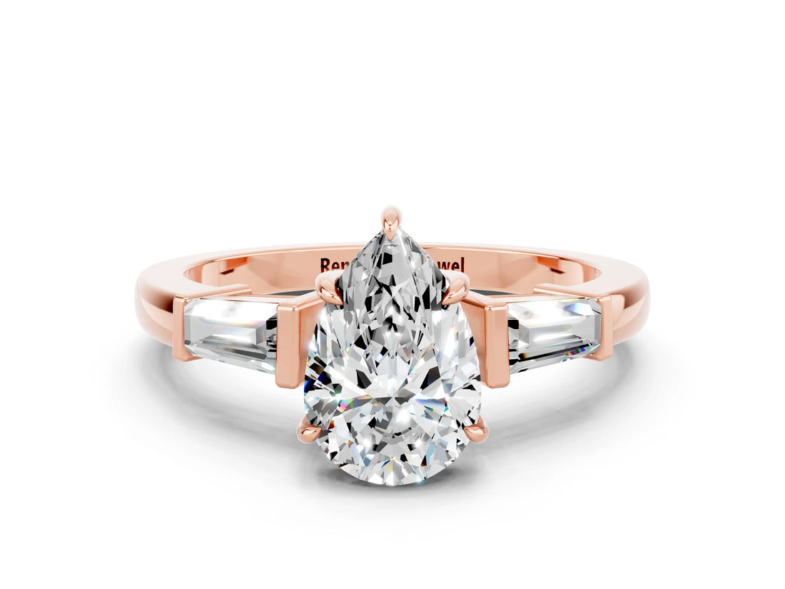 Rose gold Pear Cut Cut Diamond Ring with Tapered Baguette Side Stones in Four-Prong Setting