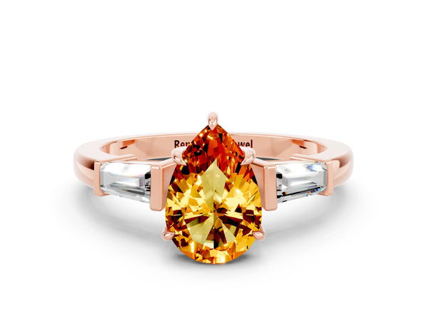 Rose gold Pear Cut Citrine Three-Stone Ring with Tapered Baguette Side Stones and Prong Setting