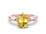 Rose gold Pear Cut Cut Diamond Ring with Tapered Baguette Side Stones in Four-Prong Setting