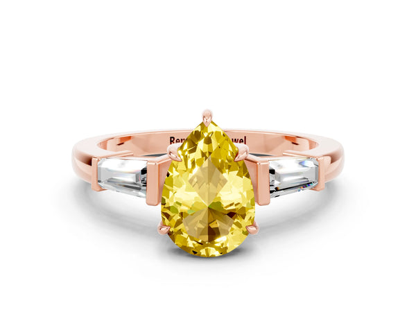 Rose gold Pear Cut Yellow Sapphire Three-Stone Ring with Tapered Baguette Side Stones and Prong Setting
