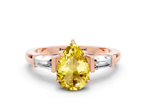 Rose gold Pear Cut Cut Diamond Ring with Tapered Baguette Side Stones in Four-Prong Setting