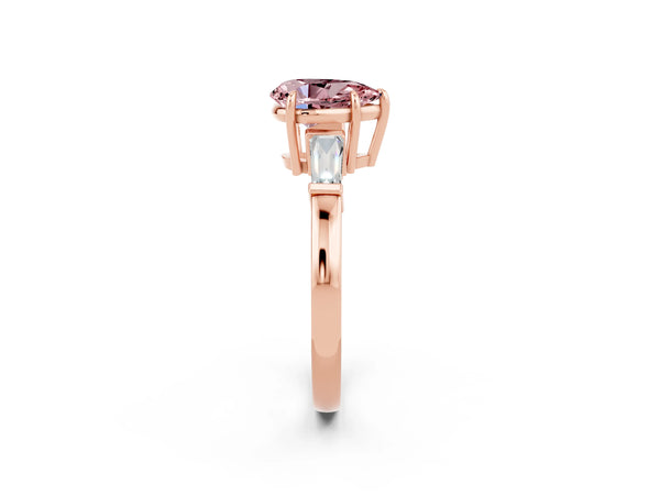 Rose gold Pear Cut Cut Diamond Ring with Tapered Baguette Side Stones in Four-Prong Setting