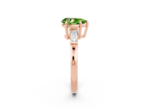 Rose gold Pear Cut Cut Diamond Ring with Tapered Baguette Side Stones in Four-Prong Setting