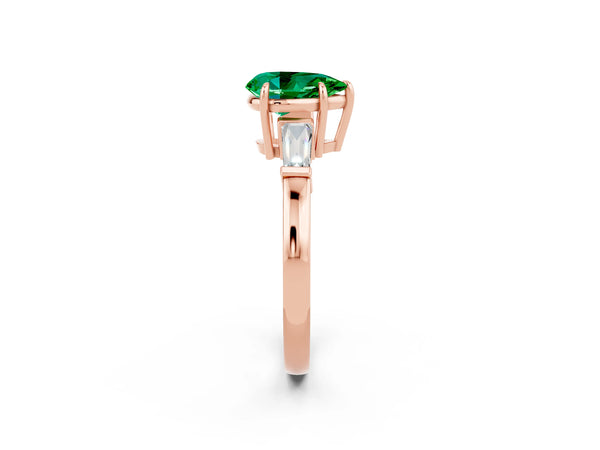 Rose gold Pear Cut Emerald Three-Stone Ring with Tapered Baguette Side Stones and Prong Setting