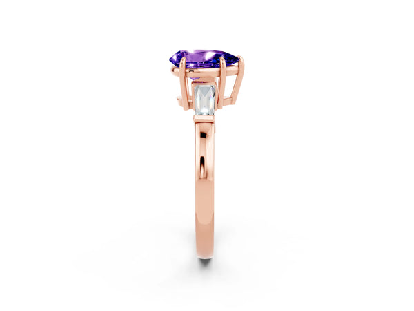 Rose gold Pear Cut Tanzanite Three-Stone Ring with Tapered Baguette Side Stones and Prong Setting